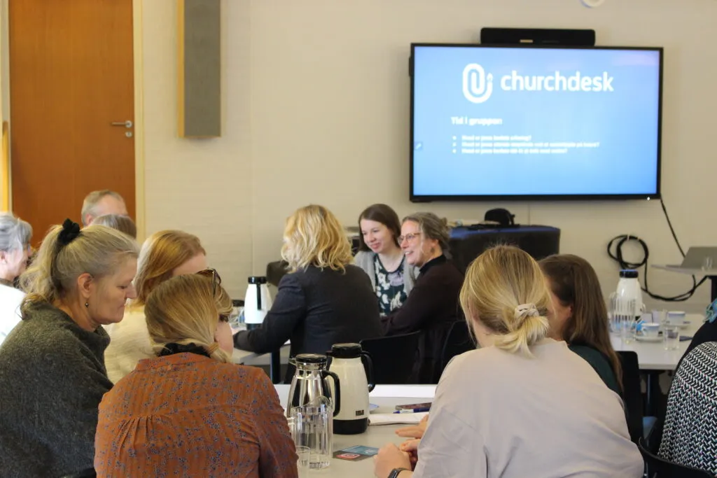 People in conversation at a church event